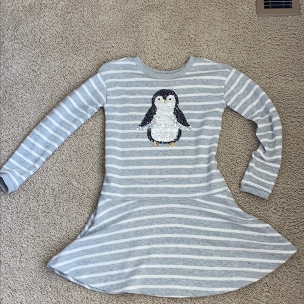 A adorable cute penguin winter dress